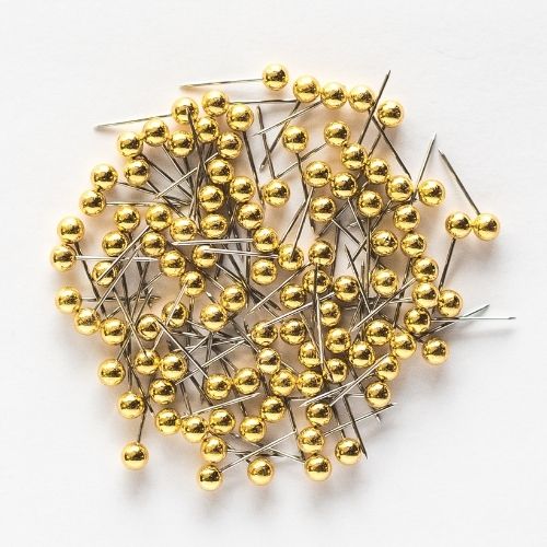 Goldfarbene Stecknadeln